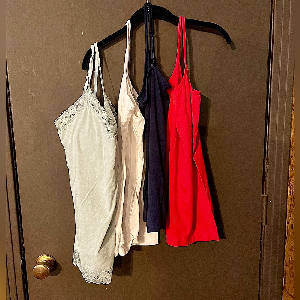 4 Spaghetti strap shirts. Size M/L